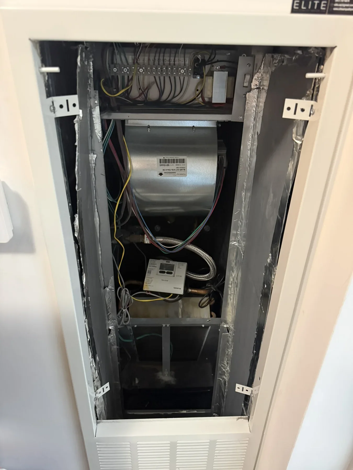 Fan-coil unit open for inspection and service
