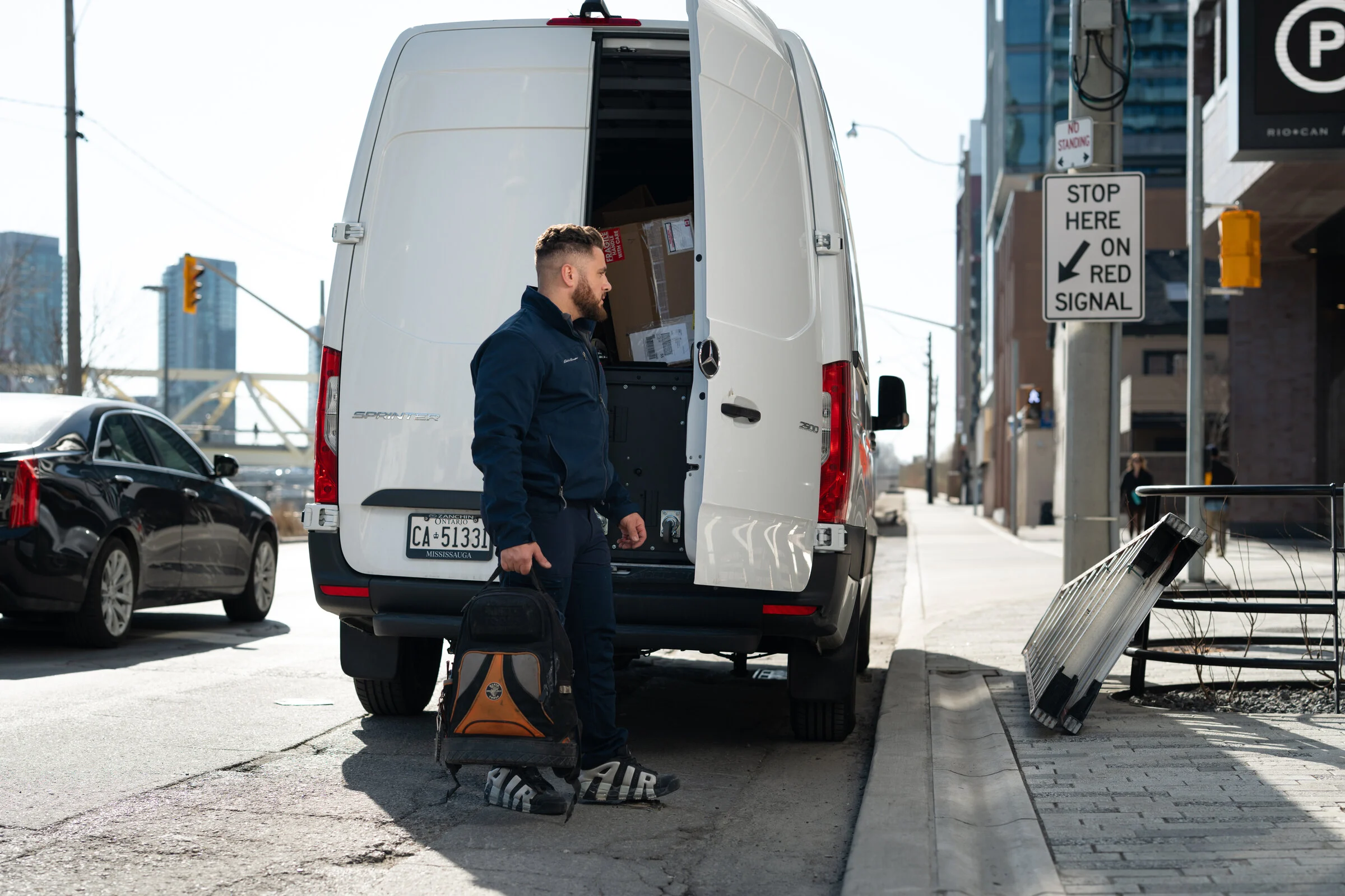 North Point HVAC technician arriving with a service van in Toronto