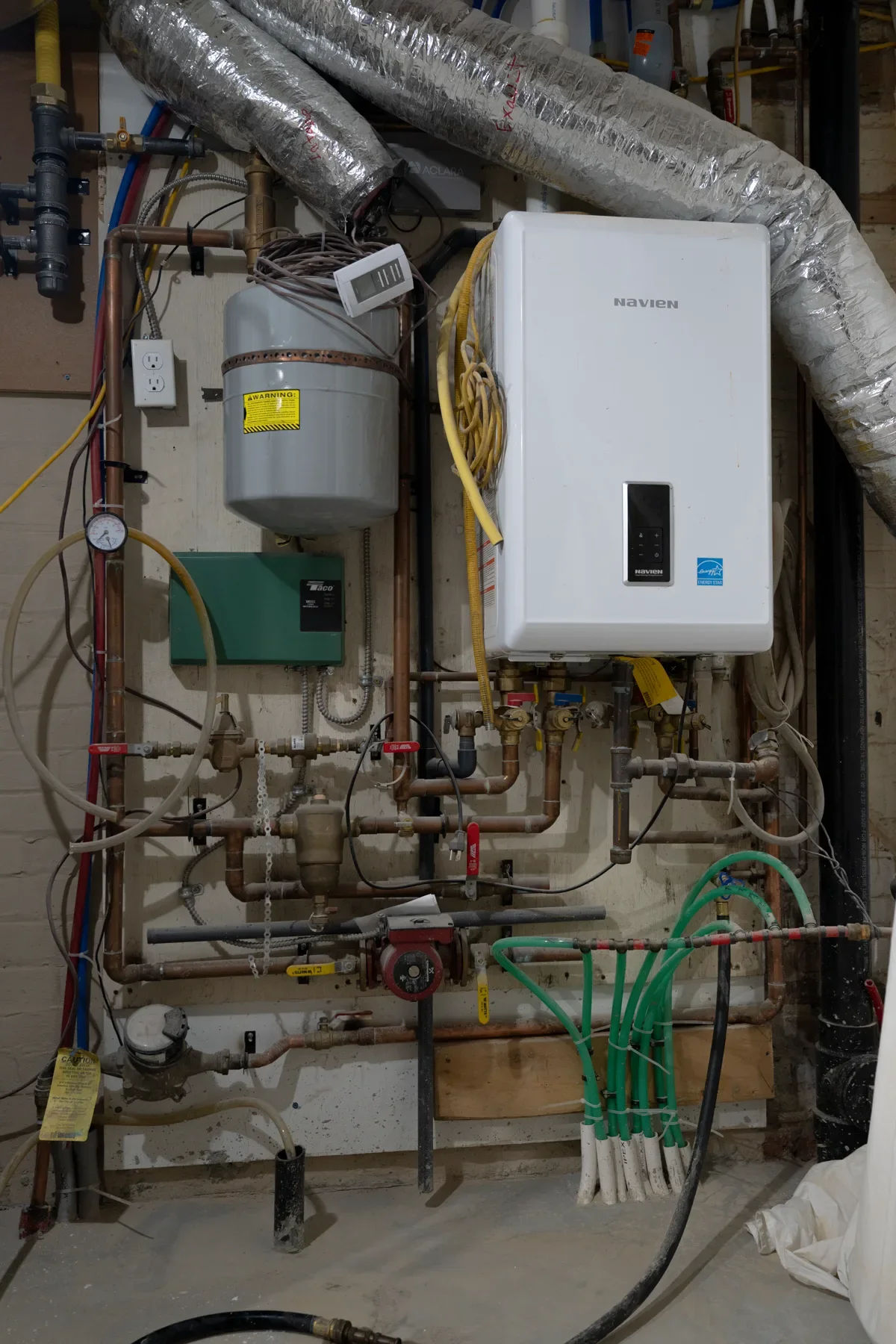 Tankless water-heater and mechanical-room piping installation